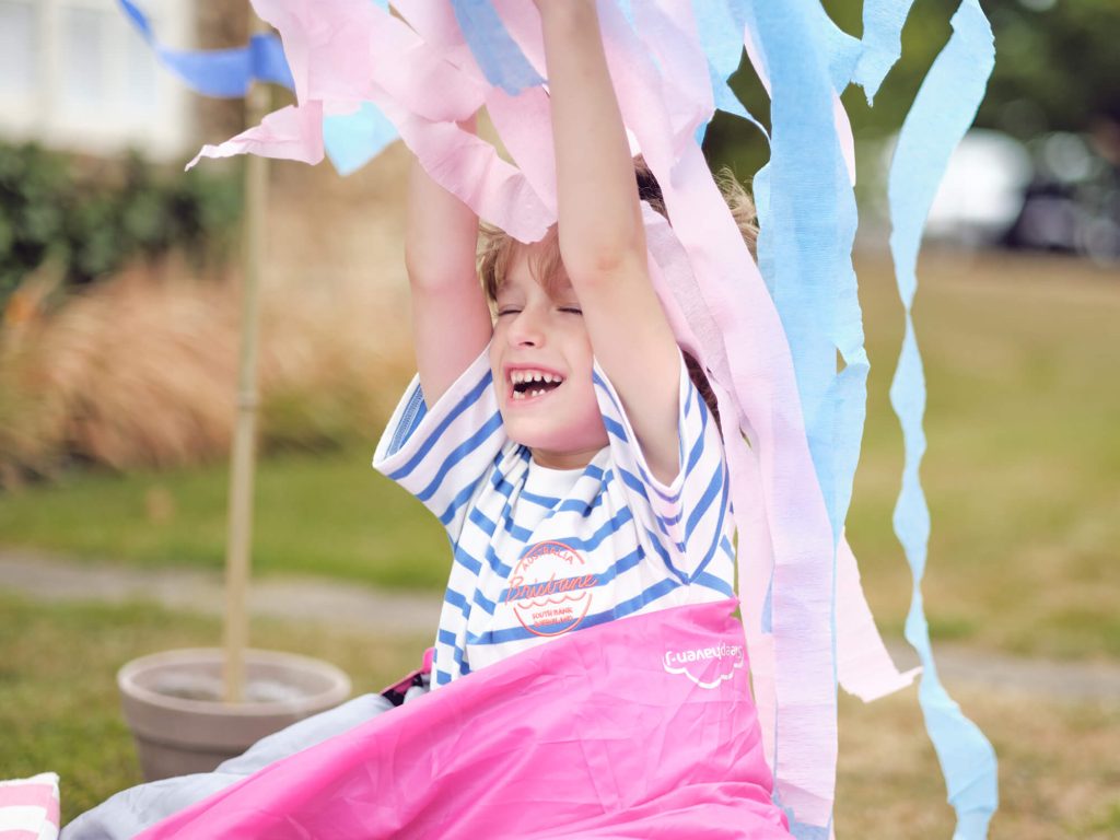 child with party streamers 
