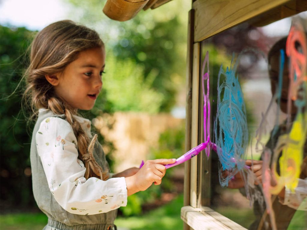 Child painting outside 