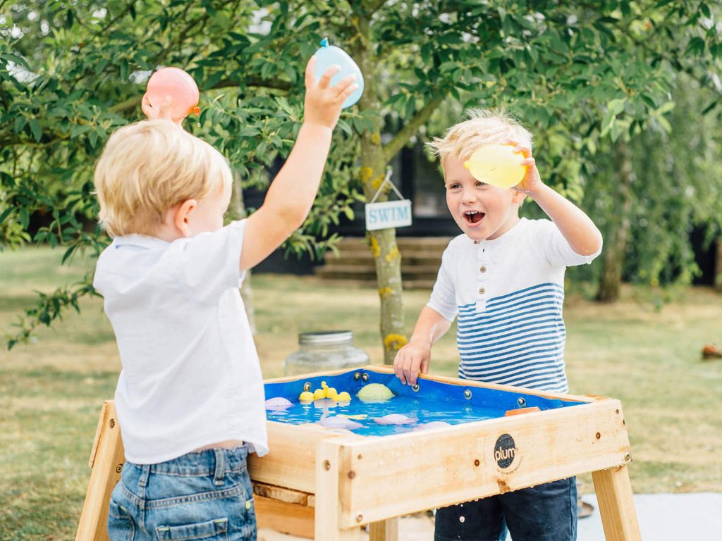 Children playing with water table